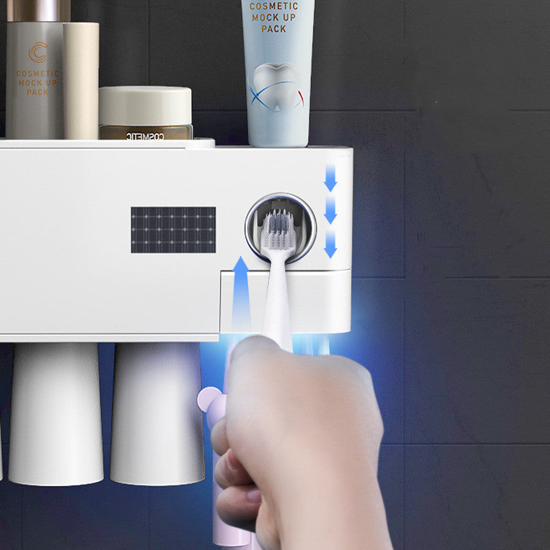 Väggmonterad stansfri tandborsthållare för desinfektion och sterilisering